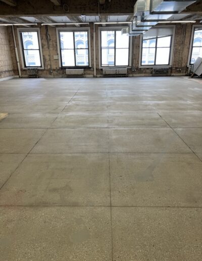 Large commercial interior with glossy, polished concrete flooring